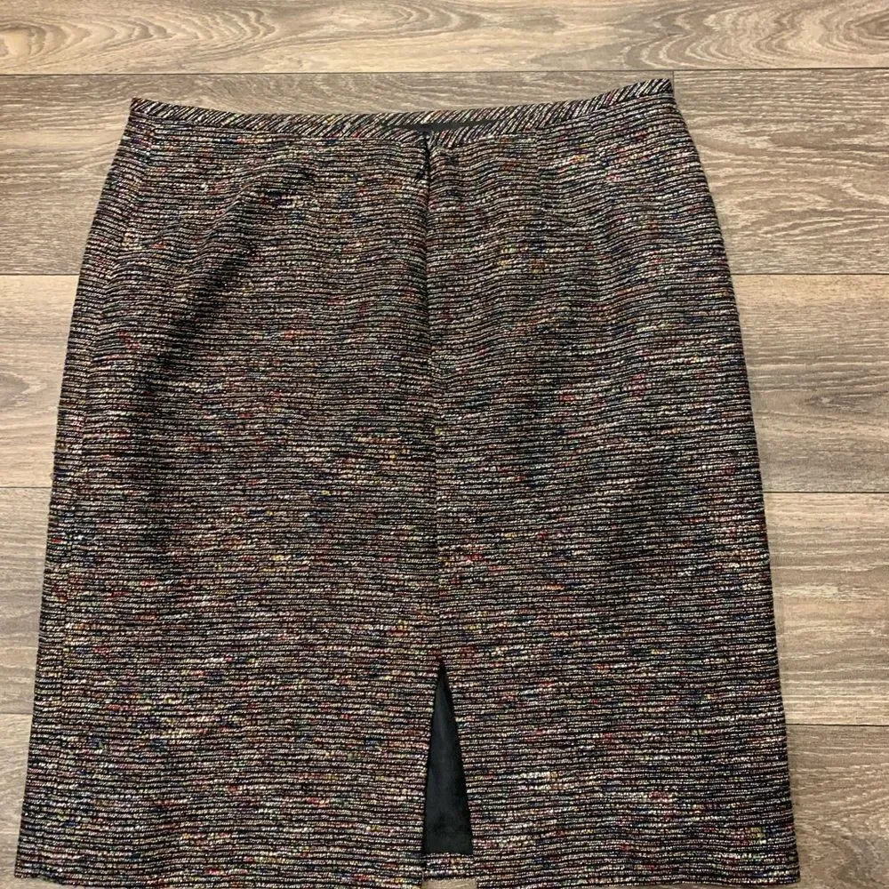 Tahari pencil skirt.  Size: 12. Small slit on back. Metallic thread throughout.